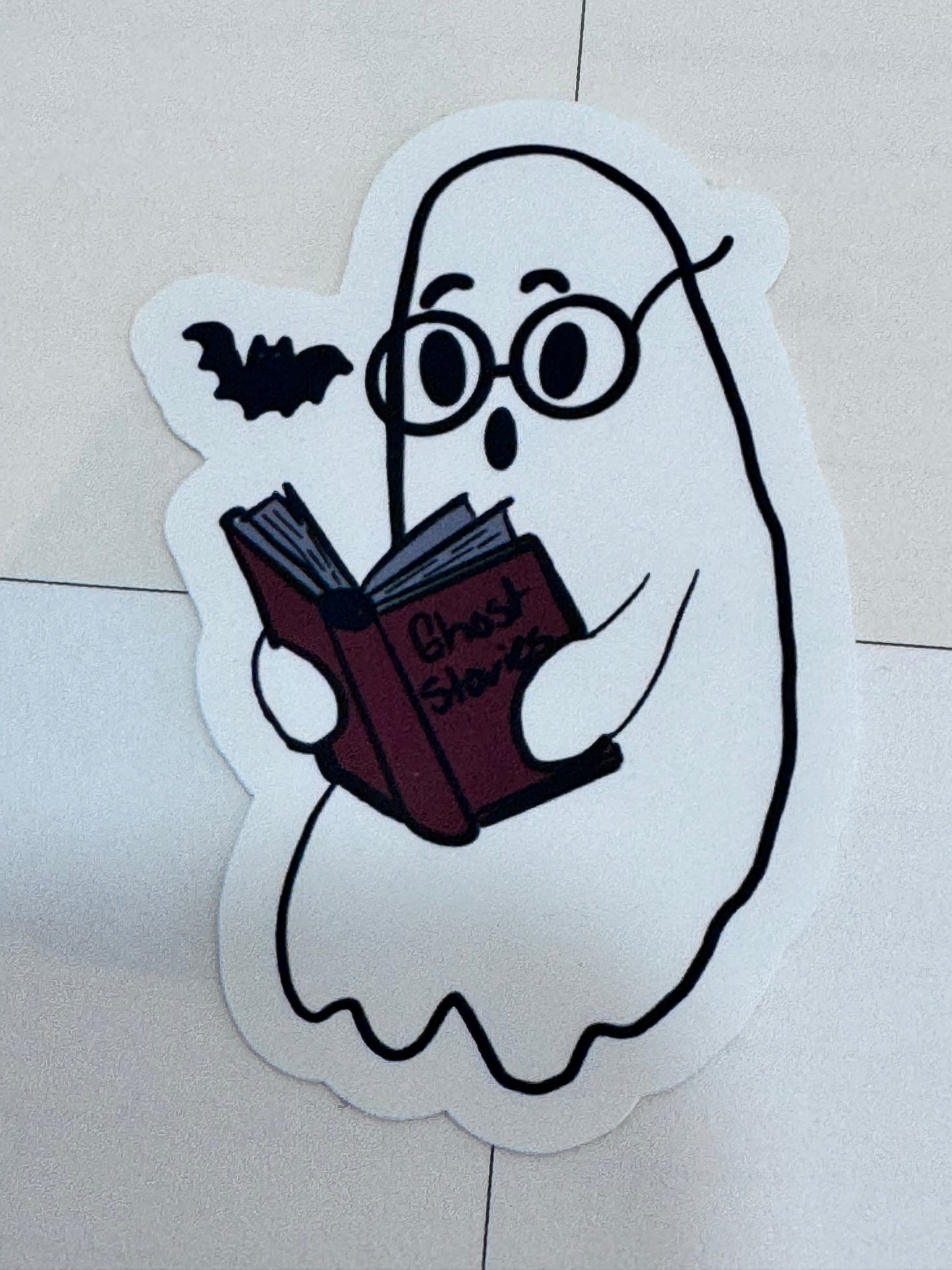 Halloween themed reader sticker featuring a ghost reading to a bat