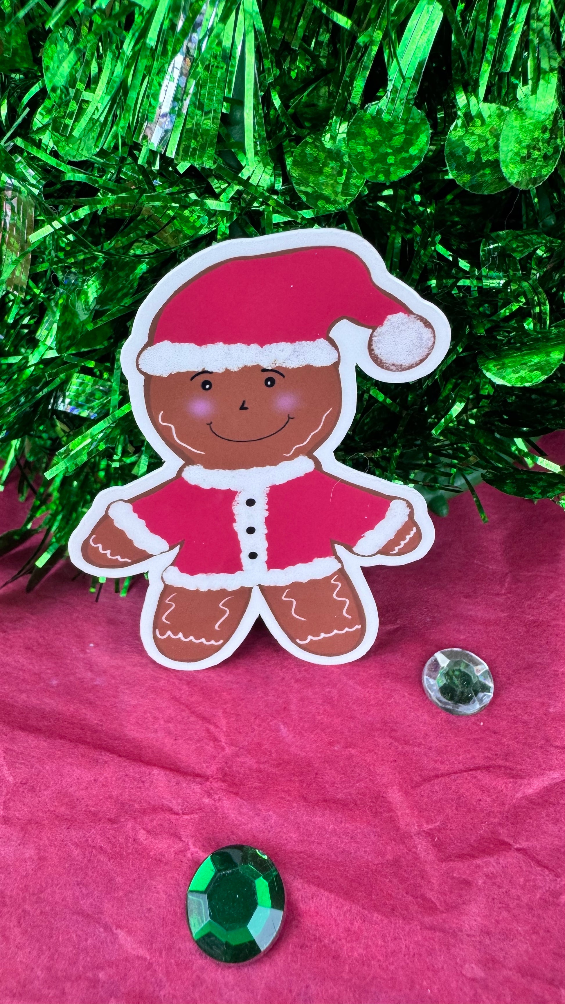 Hand drawn gingerbread man Santa sticker, laminated and handmade, shown at 2.5 inches tall.