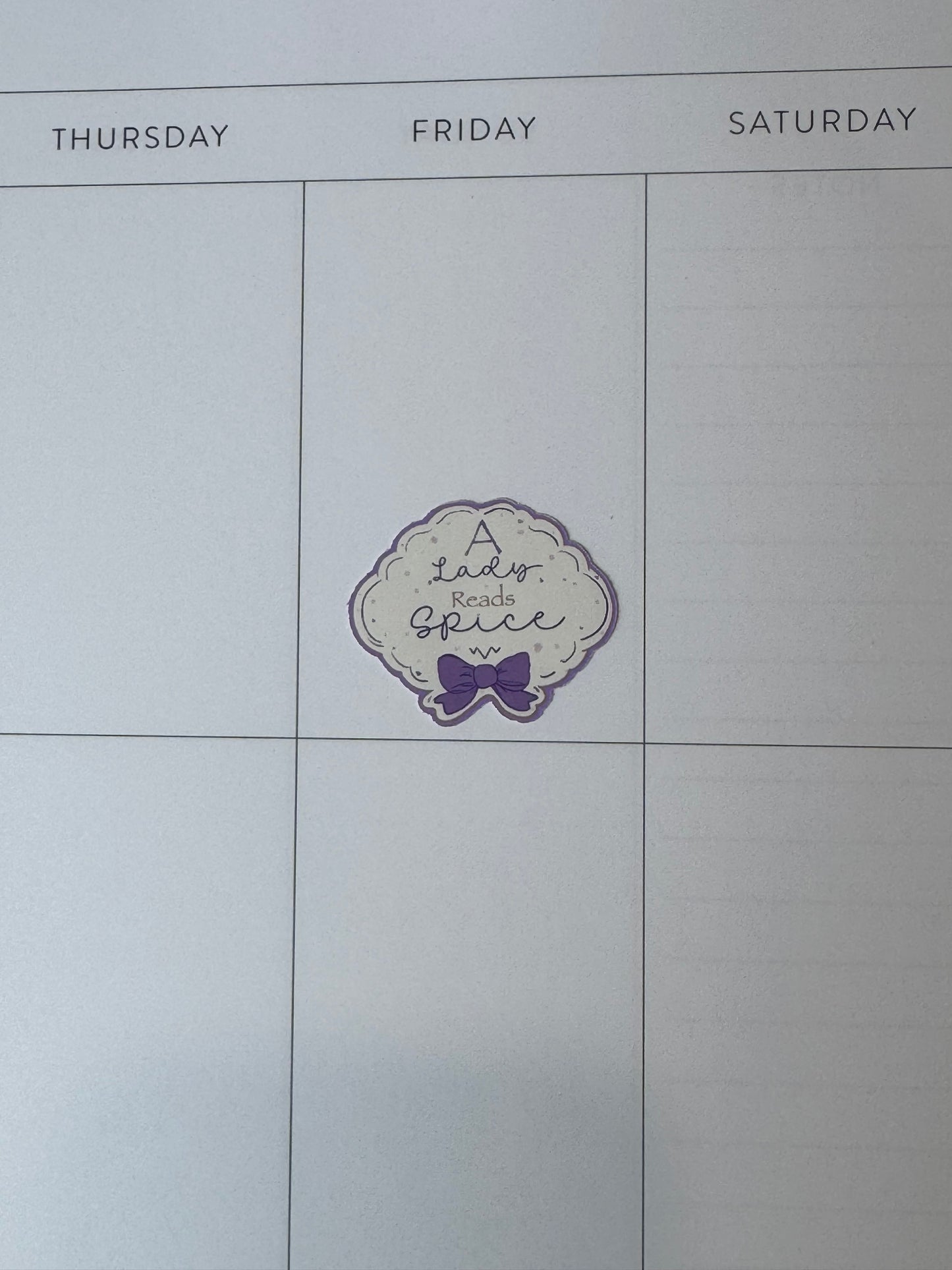 1.5 inch "A Lady Reads Spice" feminine sticker on a planner page